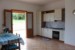 THE LIVING ROOM AND THE KITCHEN